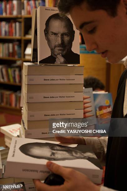 Young man takes a biography of the late "Apple" co-founder Steve Jobs, at a bookshop in Sao Paulo, Brazil, on October 24, 2011. The eagerly awaited...