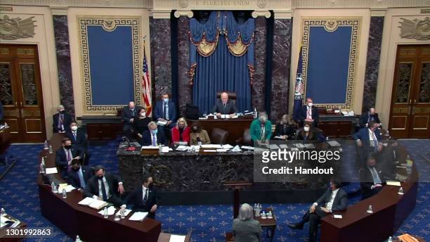 In this screenshot taken from a congress.gov webcast, the articles of impeachment are read on the floor ahead of the vote on the fifth day of former...