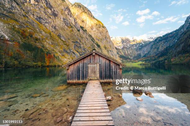 lonely boathouse on mountain lake, bavaria, germany - ponton bois photos et images de collection