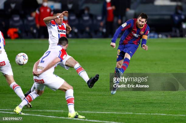 Lionel Messi of FC Barcelona scores their side's second goal during the La Liga Santander match between FC Barcelona and Deportivo Alavés at Camp Nou...