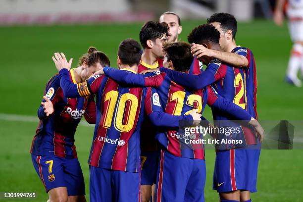 Lionel Messi of FC Barcelona celebrates with team mates after scoring their side's second goal during the La Liga Santander match between FC...