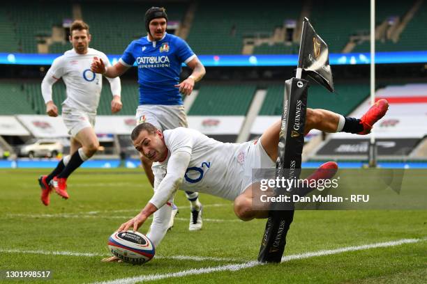 Jonny May of England dives over in to score his side's third try during the Guinness Six Nations match between England and Italy at Twickenham...