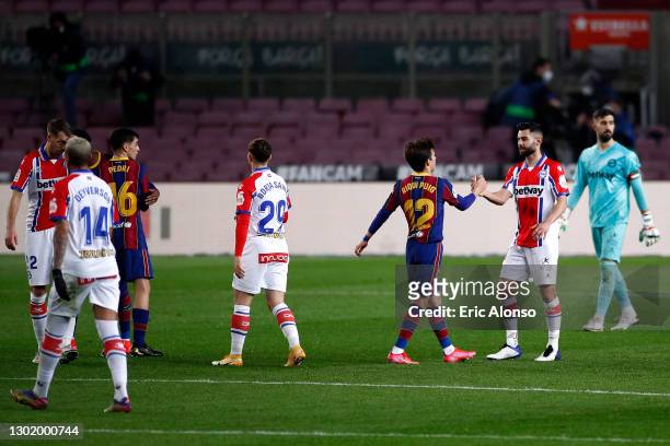 Ricard Puig Marti of FC Barcelona interacts with Ruben Duarte of Deportivo Alaves following the La Liga Santander match between FC Barcelona and...
