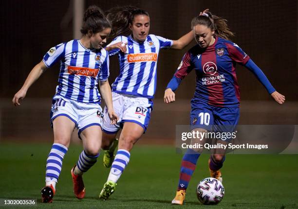 Estefania Banini of Levante UD competes for the ball with Cecilia Marcos of Real Sociedad during the Primera Division Femenina match between Levante...