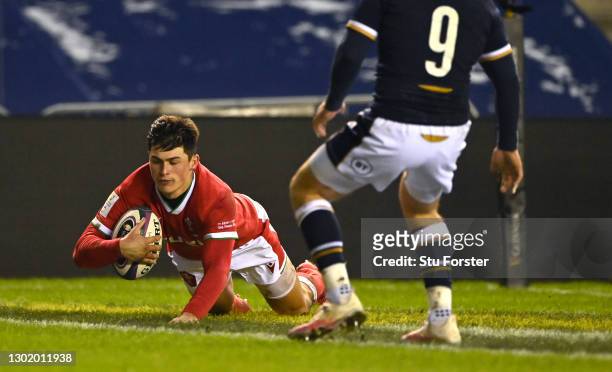 Wales wing Louis Rees-Zammit crosses for his first try during the Guinness Six Nations match between Scotland and Wales at Murrayfield on February...