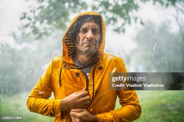 man standing under the rain - drenched stock pictures, royalty-free photos & images