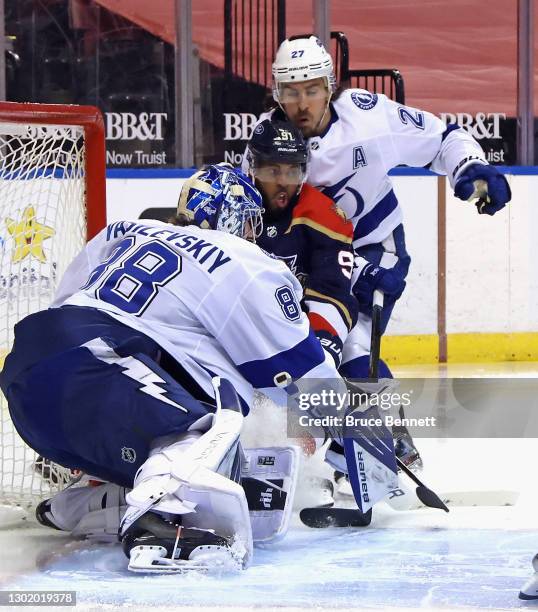 Andrei Vasilevskiy and Ryan McDonagh of the Tampa Bay Lightning defend the net against Anthony Duclair of the Florida Panthers during the second...
