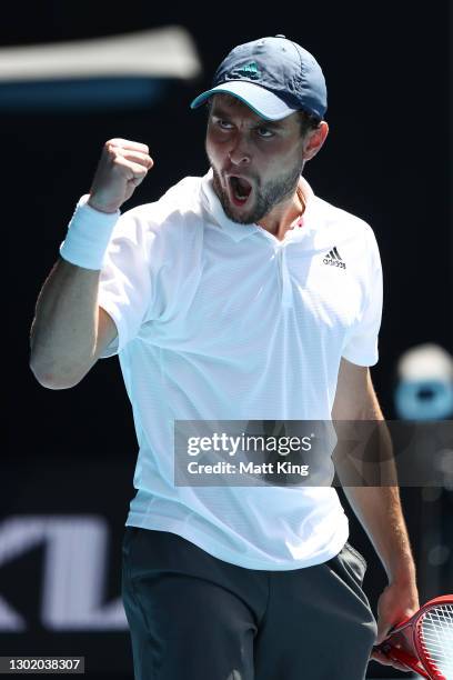 Aslan Karatsev of Russia celebrates winning the fourth set in his Men's Singles fourth round match against Felix Auger-Aliassime of Canada during day...