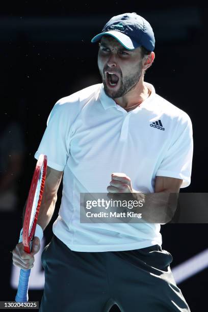 Aslan Karatsev of Russia celebrates after winning match point in his Men's Singles fourth round match against Felix Auger-Aliassime of Canada during...