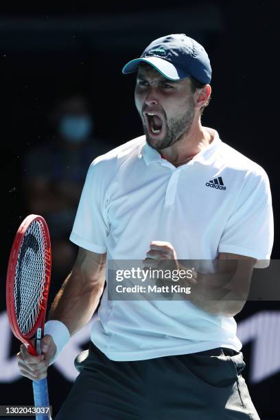 Aslan Karatsev of Russia celebrates after winning match point in his Men's Singles fourth round match against Felix Auger-Aliassime of Canada during...