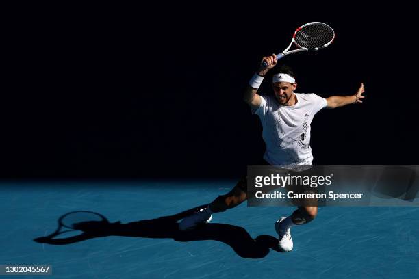 Dominic Thiem of Austria plays a forehand in his Men's Singles fourth round match against Grigor Dimitrov of Bulgaria during day seven of the 2021...