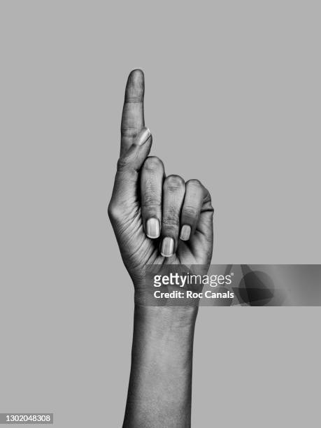 human hand with finger pointing up - daumen drücken stock-fotos und bilder