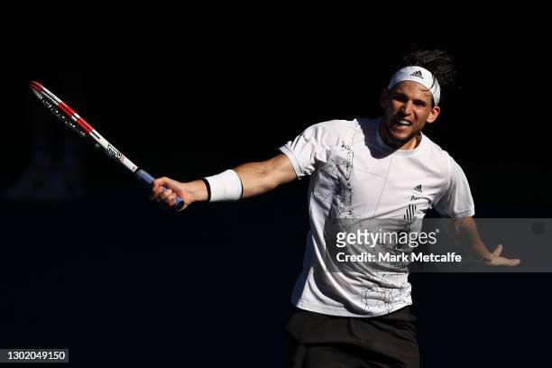 Dominic Thiem of Austria plays a backhand in his Men's Singles fourth round match against Grigor Dimitrov of Bulgaria during day seven of the 2021...