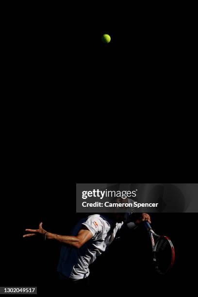 Dominic Thiem of Austria serves in his Men's Singles fourth round match against Grigor Dimitrov of Bulgaria during day seven of the 2021 Australian...