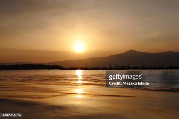 sunset over lake biwa (lake biwako) ,japan - omi stock pictures, royalty-free photos & images
