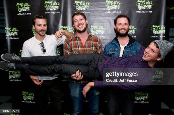 John Gourley, Zachary Carothers, Jason Sechrist and Ryan Neighbors of Portugal. The Man pose at the Radio 104.5 Performance Theater on October 24,...