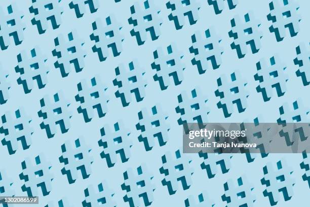 pattern made of hashtag symbol on pastel blue background. online technology concept, creativity, social media marketing. flat lay, top view - hashtag stockfoto's en -beelden