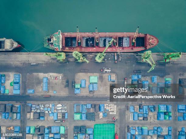 drone point view of cargo ship in the port - metal ore stock pictures, royalty-free photos & images
