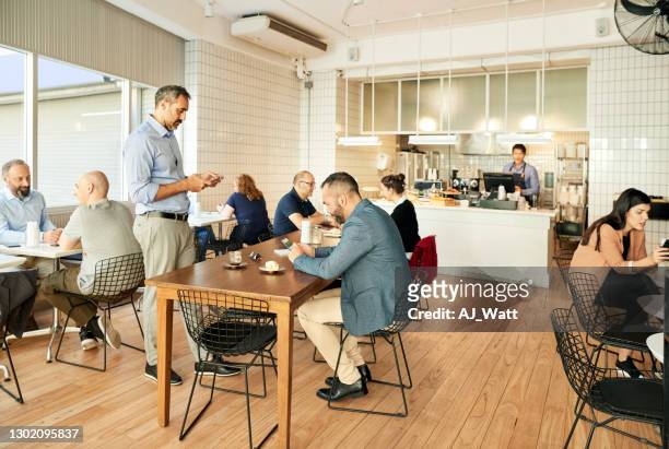 local coffee shop - town meeting stock pictures, royalty-free photos & images