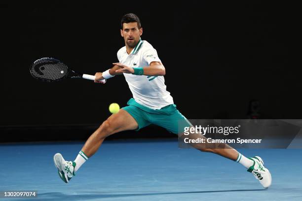Novak Djokovic of Serbia plays a forehand in his Men's Singles fourth round match against Milos Raonic of Canada during day seven of the 2021...