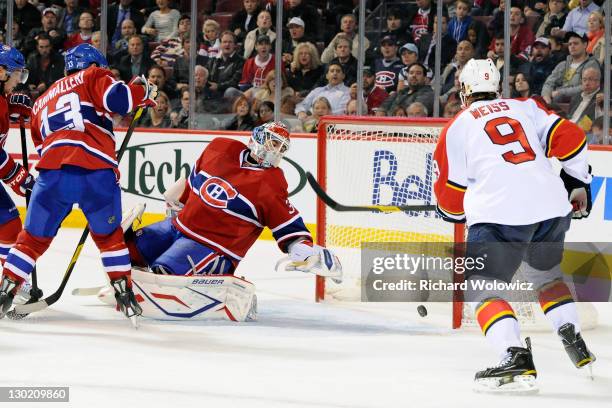 Peter Budaj of the Montreal Canadiens watches the puck go into the net on a goal by Tomas Fleischmann of the Florida Panthers during the NHL game at...