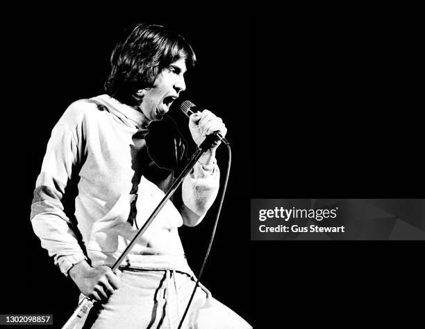 Peter Gabriel performs on stage at the Hammersmith Odeon, London, England, on April 24th 1977.