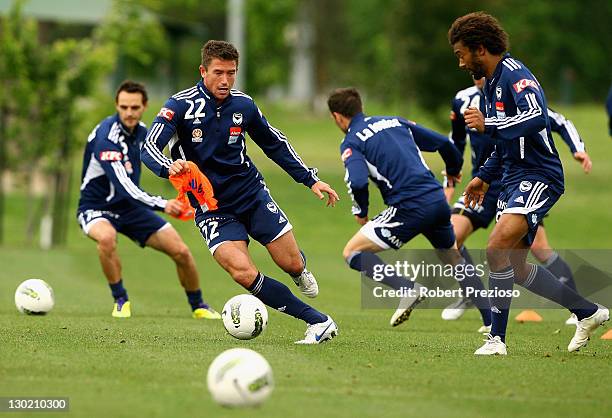 Harry Kewell completes drills with team-mates during a Melbourne Victory A-League training session at Gosch's Paddock on October 25, 2011 in...