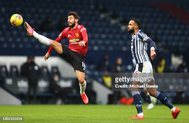 Bruno Fernandes of Manchester United controls the ball whilst under pressure from Kyle Bartley of West Bromwich Albion during the Premier League...
