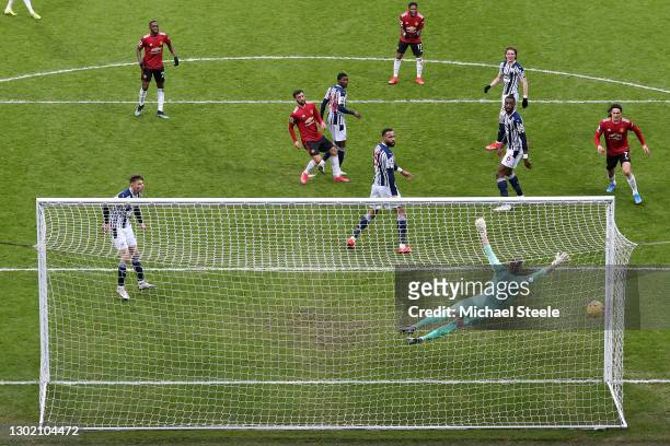 Bruno Fernandes of Manchester United scores their side's first goal past Sam Johnstone of West Bromwich Albion during the Premier League match...