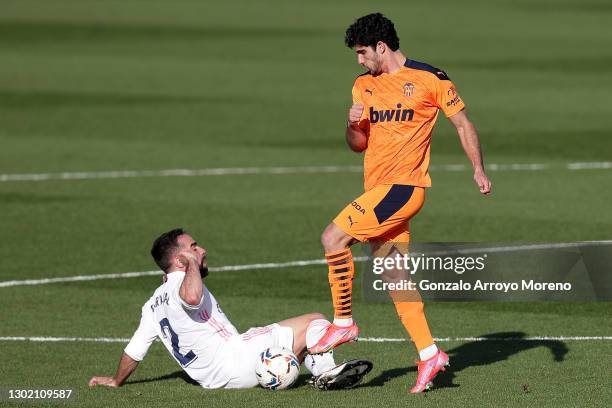 Dani Carvajal of Real Madrid and Goncalo Guedes of Valencia CF battle for possession during the La Liga Santander match between Real Madrid and...