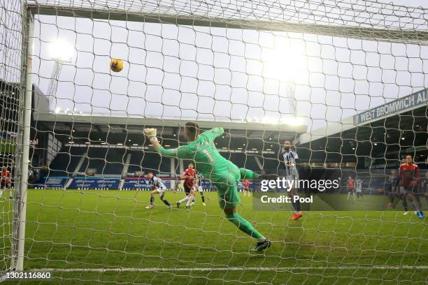 Sam Johnstone of West Bromwich Albion makes save from the shot of Harry Maguire of Manchester United during the Premier League match between West...