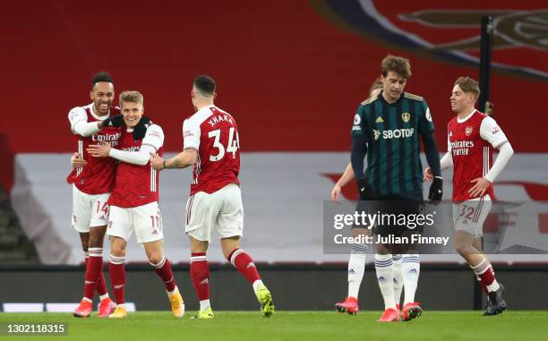 Pierre Emerick Aubameyang of Arsenal celebrates with team mates Martin Odegaard and Granit Xhaka after scoring their side's first goal during the...