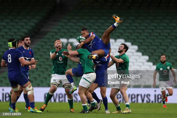 Teddy Thomas of France gathers a high ball under pressure as Robbie Henshaw of Ireland looks on during the Guinness Six Nations match between Ireland...