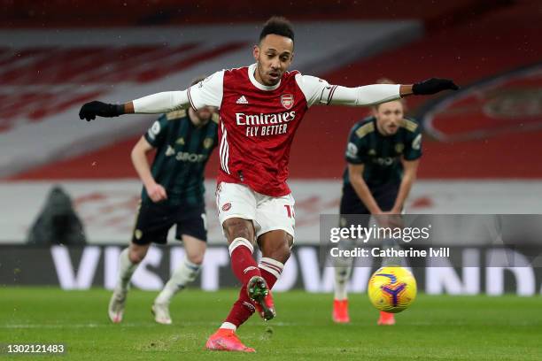 Pierre Emerick Aubameyang of Arsenal scores their side's second goal from the penalty spot during the Premier League match between Arsenal and Leeds...