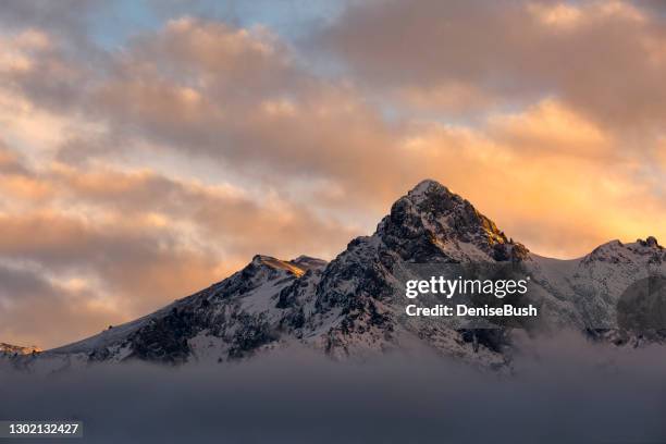 mountain above the clouds - summit stock pictures, royalty-free photos & images