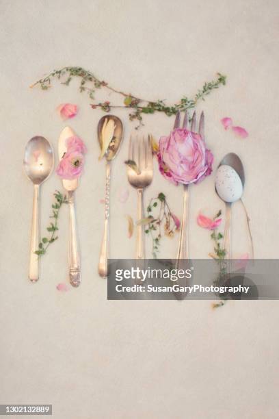 circa 1920 silverware with pink flowers - metal flower arrangement stock pictures, royalty-free photos & images