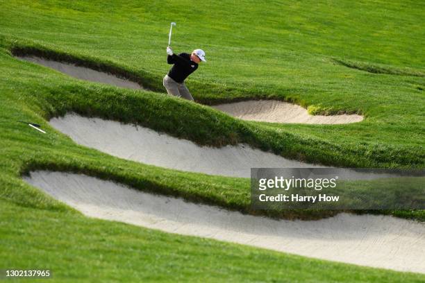 Charley Hoffman of the United States plays a shot from a bunker on the sixth hole during the final round of the AT&T Pebble Beach Pro-Am at Pebble...