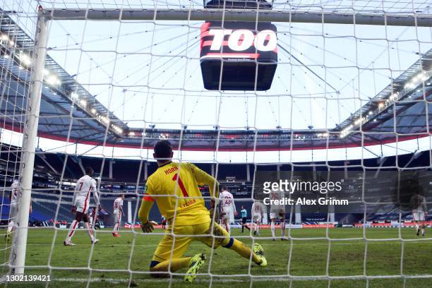 Goalkeeper Timo Horn of Koeln reacts after Evan N'Dicka of Frankfurt scored his team's second goal during the Bundesliga match between Eintracht...