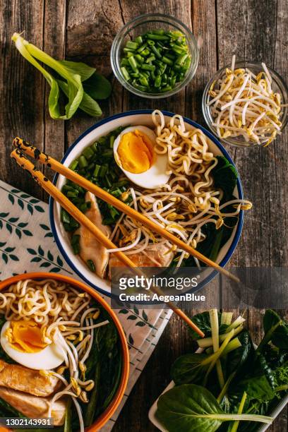 ramen soup on rustic wooden table - ramen noodles stock pictures, royalty-free photos & images