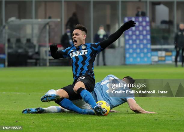 Lautaro Martínez of FC Internazionale is challenged by by Wesley Hoedt of SS Lazio during the Serie A match between FC Internazionale and SS Lazio at...