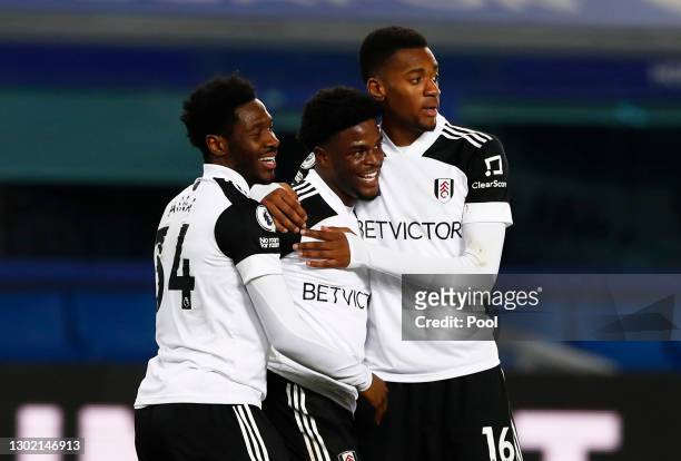 Josh Maja of Fulham celebrates with team mates Ola Aina and Tosin Adarabioyo after scoring their side's second goal during the Premier League match...