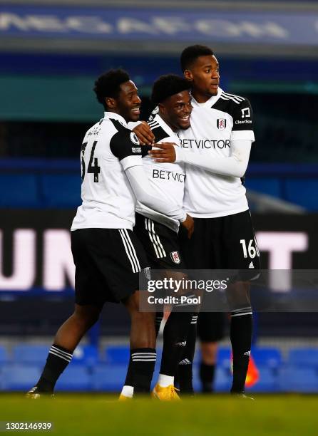 Josh Maja of Fulham celebrates with team mates Ola Aina and Tosin Adarabioyo after scoring their side's second goal during the Premier League match...