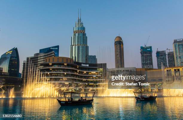 dubai mall fountain show in front of dubai mall in the uae - dubai fountain stock pictures, royalty-free photos & images