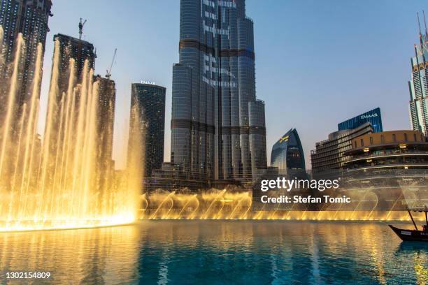 dubai mall fountain show in front of dubai mall in the uae - dubai fountain stock pictures, royalty-free photos & images