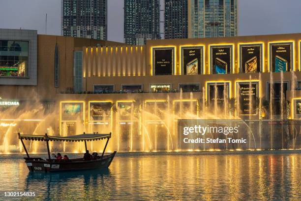 dubai mall fountain show in front of dubai mall in the uae - dubai mall stock pictures, royalty-free photos & images