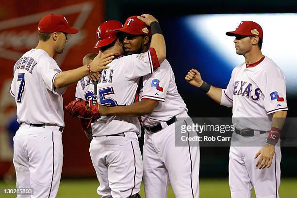 Mike Napoli and Neftali Feliz of the Texas Rangers celebrate after defeating the St. Louis Cardinals 4--2 during Game Five of the MLB World Series at...
