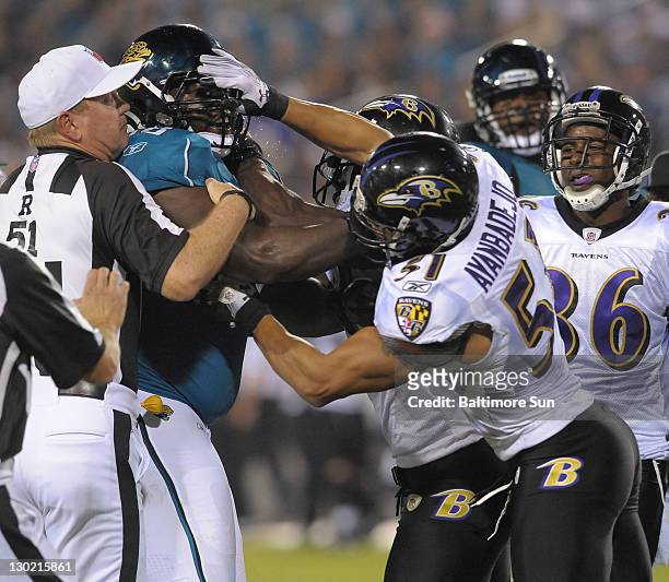 Baltimore Ravens Brendon Ayanbadejo was ejected for this punch to the face of Jacksonville Jaguars' Guy Whimper at EverBank Field in Jacksonville,...