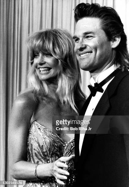 Actors Goldie Hawn and Kurt Russell at the 71st Annual Academy Awards, March 21,1999 in Los Angeles, California.
