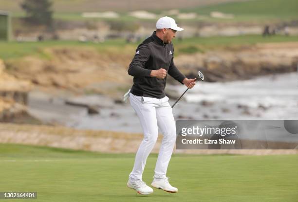 Daniel Berger of the United States celebrates his eagle putt to win on the 18th green during the final round of the AT&T Pebble Beach Pro-Am at...