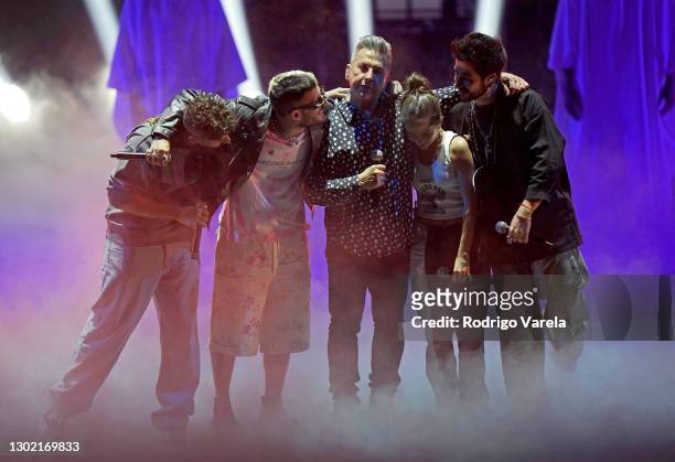 Mauricio Montaner and Ricky Montaner of Mau y Ricky, Ricardo Montaner, Evaluna Montaner, and Camilo perform onstage during rehearsals for Univision's...